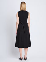Back full length image of model wearing Ivy Wrap Dress in BLACK