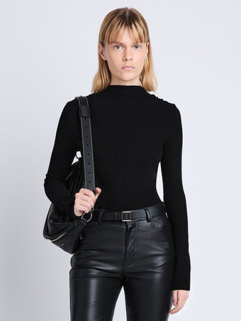 Cropped front image of model wearing Charlie Top in BLACK