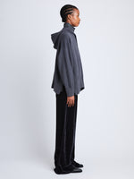Side full length image of model wearing Cleo Sweatshirt in DARK GREY/ BLUE