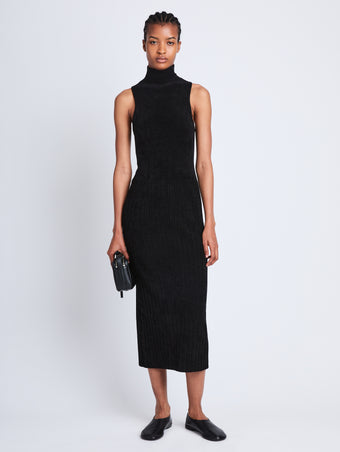 Front full length image of model wearing Dylan Turtleneck Dress in BLACK