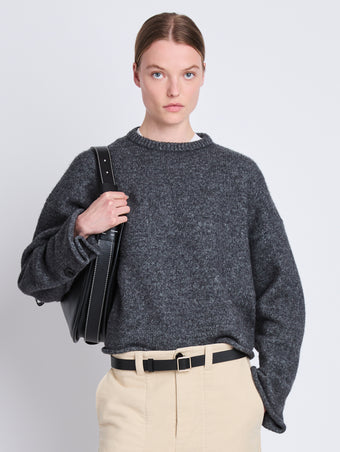 Front cropped image of model wearing Tara Sweater in GREY MELANGE