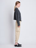 Side full length image of model wearing Tara Sweater in GREY MELANGE