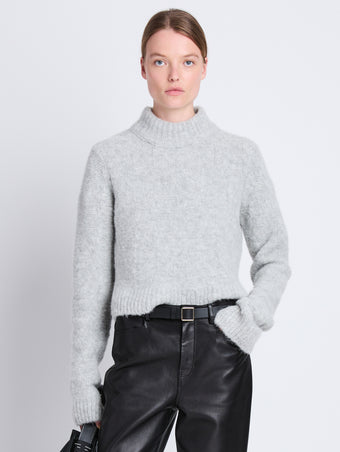 Front cropped image of model wearing Brigitt Sweater in LIGHT GREY MELANGE
