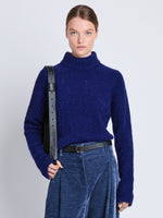 Front cropped image of model wearing Brigitt Sweater in COBALT MELANGE