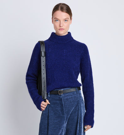 Front cropped image of model wearing Brigitt Sweater in COBALT MELANGE