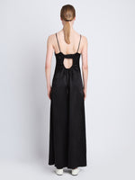 Back full length image of model wearing Harper Backless Dress in BLACK