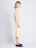 Side full length image of model wearing Olivia Sweatshirt in SAND