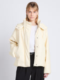 Cropped front image of model in Daylia Jacket In Faux Leather in parchment