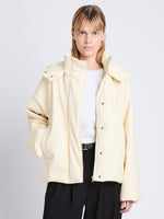 Cropped front image of model in Daylia Jacket In Faux Leather in parchment