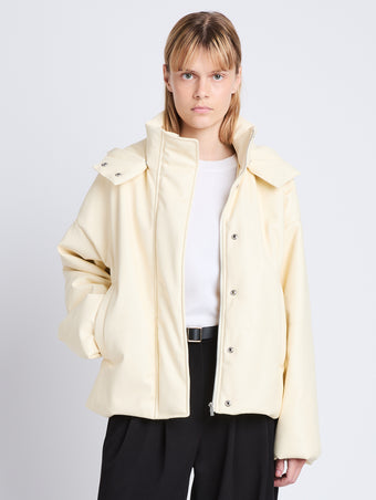 Cropped front image of model in Daylia Jacket In Faux Leather in parchment