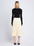 Back image of model wearing Daphne Skirt In Faux Leather in parchment