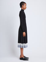 Side full length image of model wearing Lila Dress in BLACK/ASH