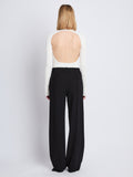 Back image of model wearing Weyes Pant in Matte Viscose Crepe in black