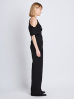 Side full length image of model wearing Francesa Off The Shoulder Top in BLACK