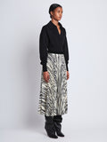 Side full length image of model wearing Korine Skirt in ECRU MULTI