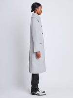 Side image of model wearing Louise Coat In Wool Cashmere in light grey melange