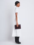 Image of model wearing Triple Zip Pouch in DEEP NAVY/GARNET/MOCHA