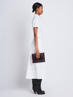 Image of model wearing Triple Zip Pouch in DEEP NAVY/GARNET/MOCHA