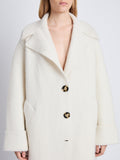 Detail image of model wearing Ruth Coat In Knit Outerwear in ivory