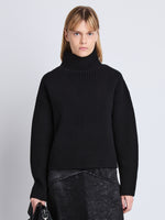 Cropped front image of model wearing Alma Sweater In Lofty Eco Cashmere in black