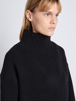 Detail image of model wearing Alma Sweater In Lofty Eco Cashmere in black
