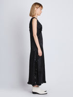 Side image of model wearing Mira Dress In Embroidered Crushed Satin in black