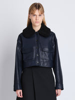 Cropped front image of model in Judd Jacket With Shearling Collar In Leather in navy