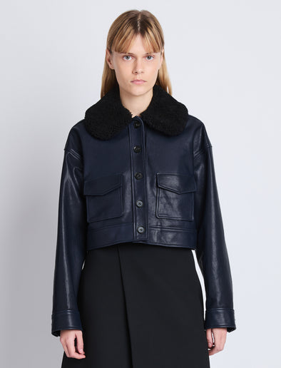 Cropped front image of model in Judd Jacket With Shearling Collar In Leather in navy