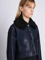 Detail image of model in Judd Jacket With Shearling Collar In Leather in navy