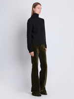 Side image of model wearing Marie Pant In Velvet Suiting in olive