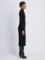 Side full length image of model wearing Midweight Viscose Rib Knit Dress in BLACK