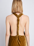 Detail image of model wearing Faye Backless Twist Back Dress In Velvet in ochre