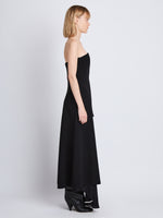 Side image of model wearing Danielle Strapless Dress In Matte Viscose Crepe in black