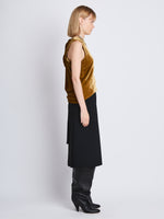 Side image of model wearing Joyce Top In Velvet in ochre