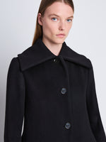 Detail image of model wearing Louise Coat in Wool Cashmere in black