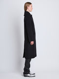 Side image of model wearing Louise Coat In Wool Cashmere in black