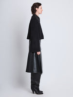 Side image of model wearing Brigdet Cropped Jacket with Leather Collar in BLACK with collar