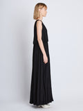Side full length image of model wearing Lynda Dress In Textured Marocaine With Boucle in BLACK