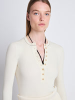 Detail image of model wearing Agnes Henley Sweater in IVORY