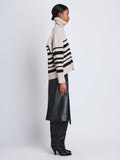 Side full length image of model wearing Sandra Turtleneck In Striped Doubleface Cashmere in OATMEAL MULTI