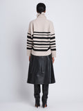 Back full length image of model wearing Sandra Turtleneck In Striped Doubleface Cashmere in OATMEAL MULTI