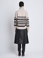 Back full length image of model wearing Sandra Turtleneck In Striped Doubleface Cashmere in OATMEAL MULTI