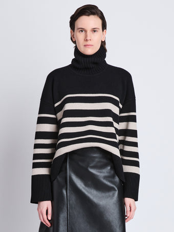 Front cropped image of model wearing Sandra Turtleneck In Striped Doubleface Cashmere in BLACK MULTI