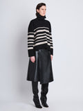 Side full length image of model wearing Sandra Turtleneck In Striped Doubleface Cashmere in BLACK MULTI