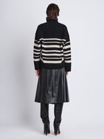 Back full length image of model wearing Sandra Turtleneck In Striped Doubleface Cashmere in BLACK MULTI