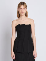 Front cropped image of model wearing Corinne Strapless Top in BLACK