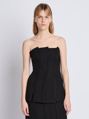 Front cropped image of model wearing Corinne Strapless Top in BLACK