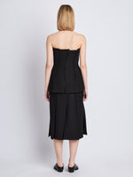 Back full length image of model wearing Corinne Strapless Top in BLACK