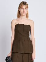 Front cropped image of model wearing Corinne Strapless Top in DARK LODEN