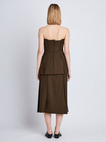 Back full length image of model wearing Corinne Strapless Top in DARK LODEN